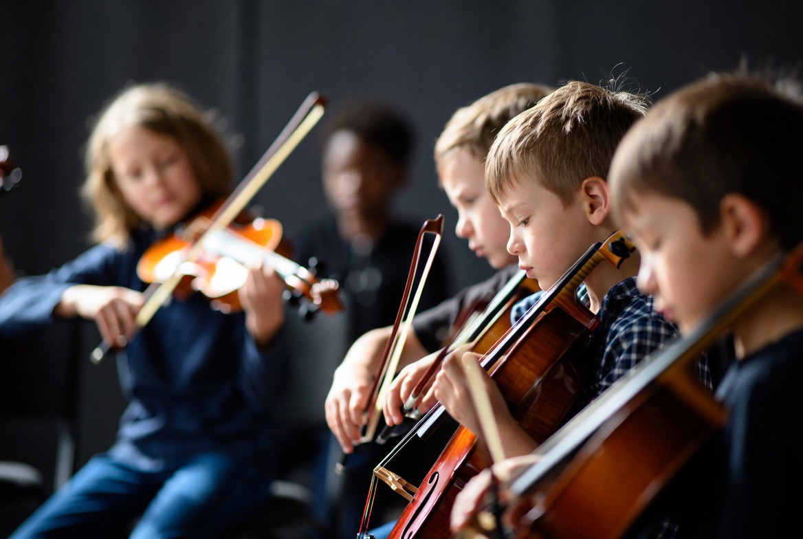 Students participating in a school music programme